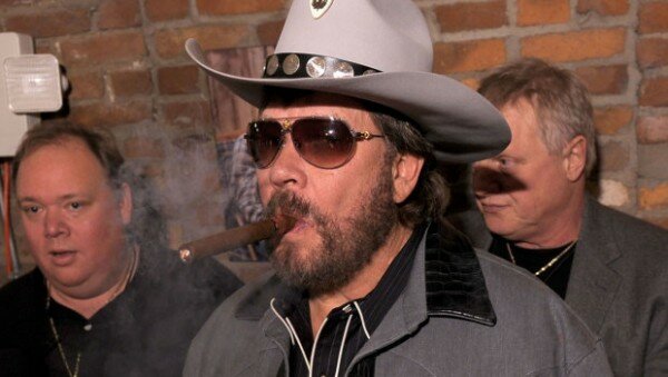 Hank Williams Jr enjoys a cigar with all his rowdy friends.